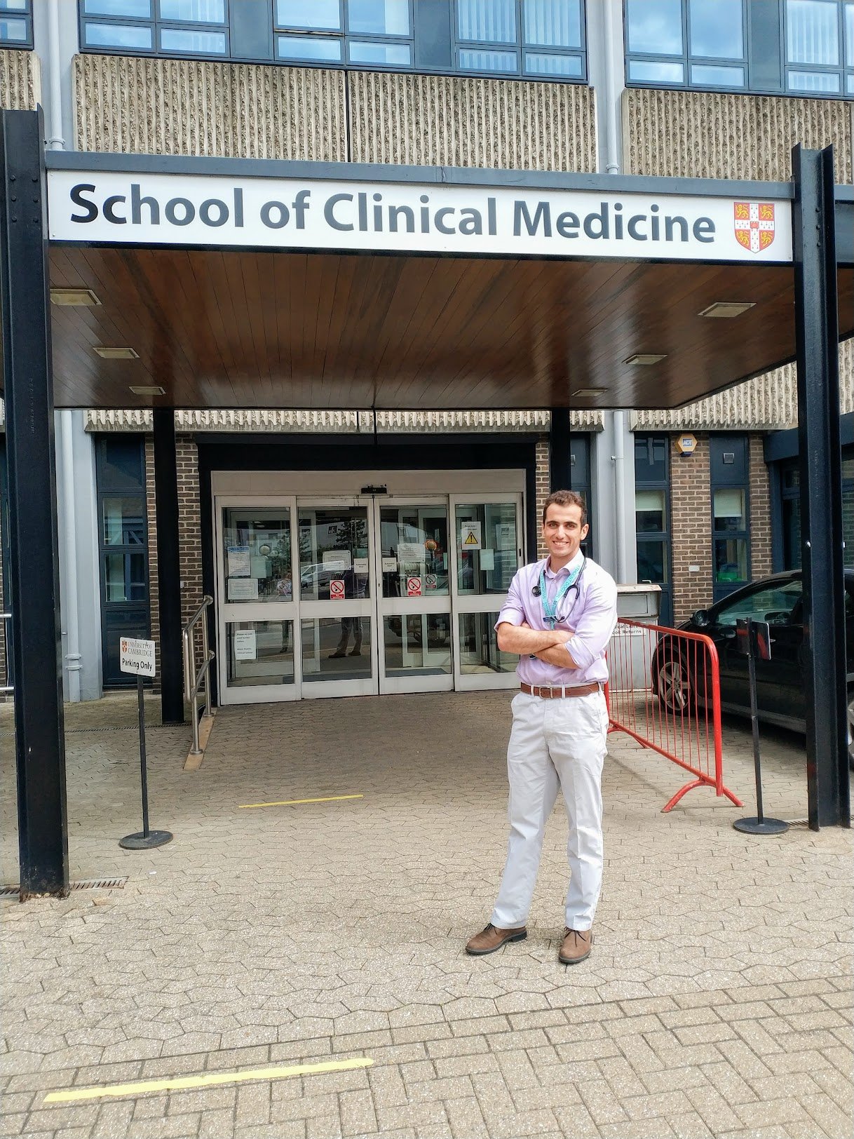 Dr. Nathan Dean stood outside Cambridge Medical School.
